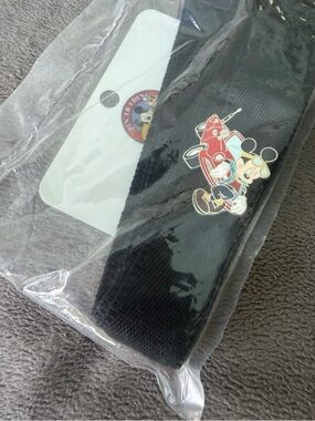 Disney Black Disney world trading pin lanyard with racing Mickey pin